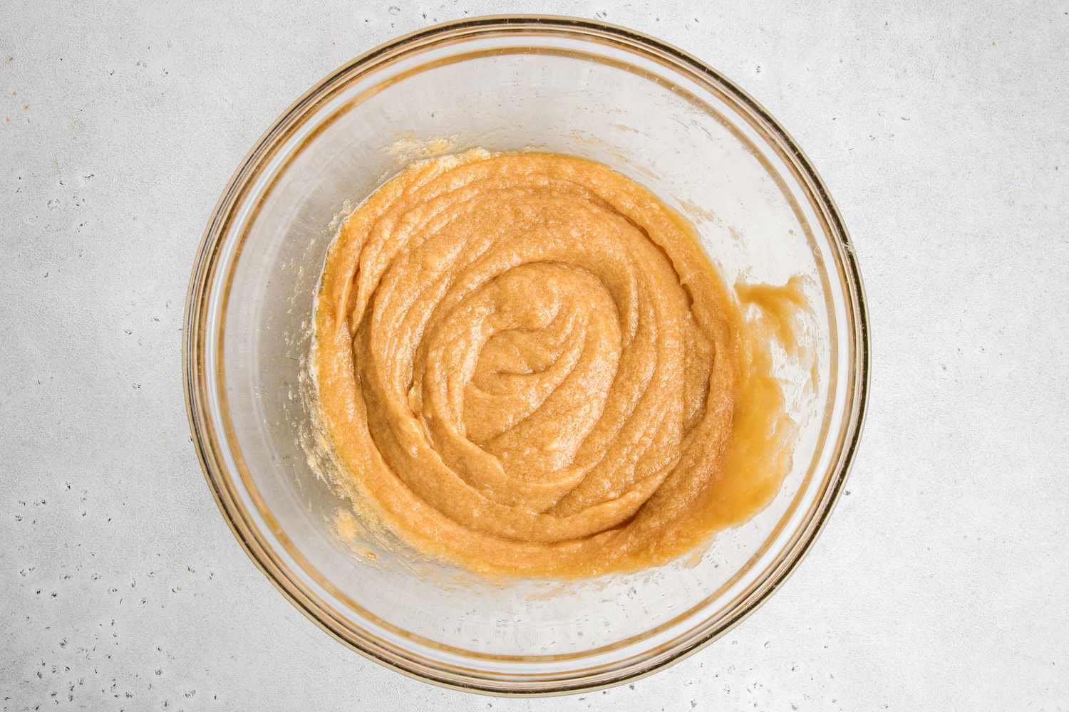 Butter, eggs, and sugar combined for easy chocolate chocolate cookie recipe.