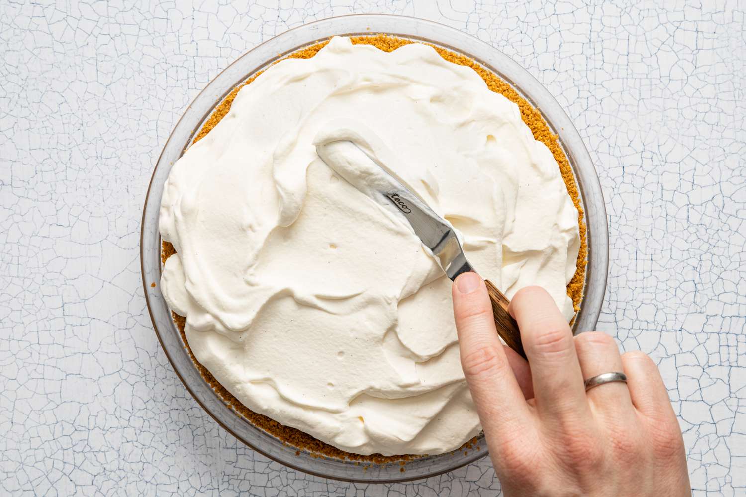 Whipped Cream Spread onto Banoffee Pie Using an Offset Spatula 