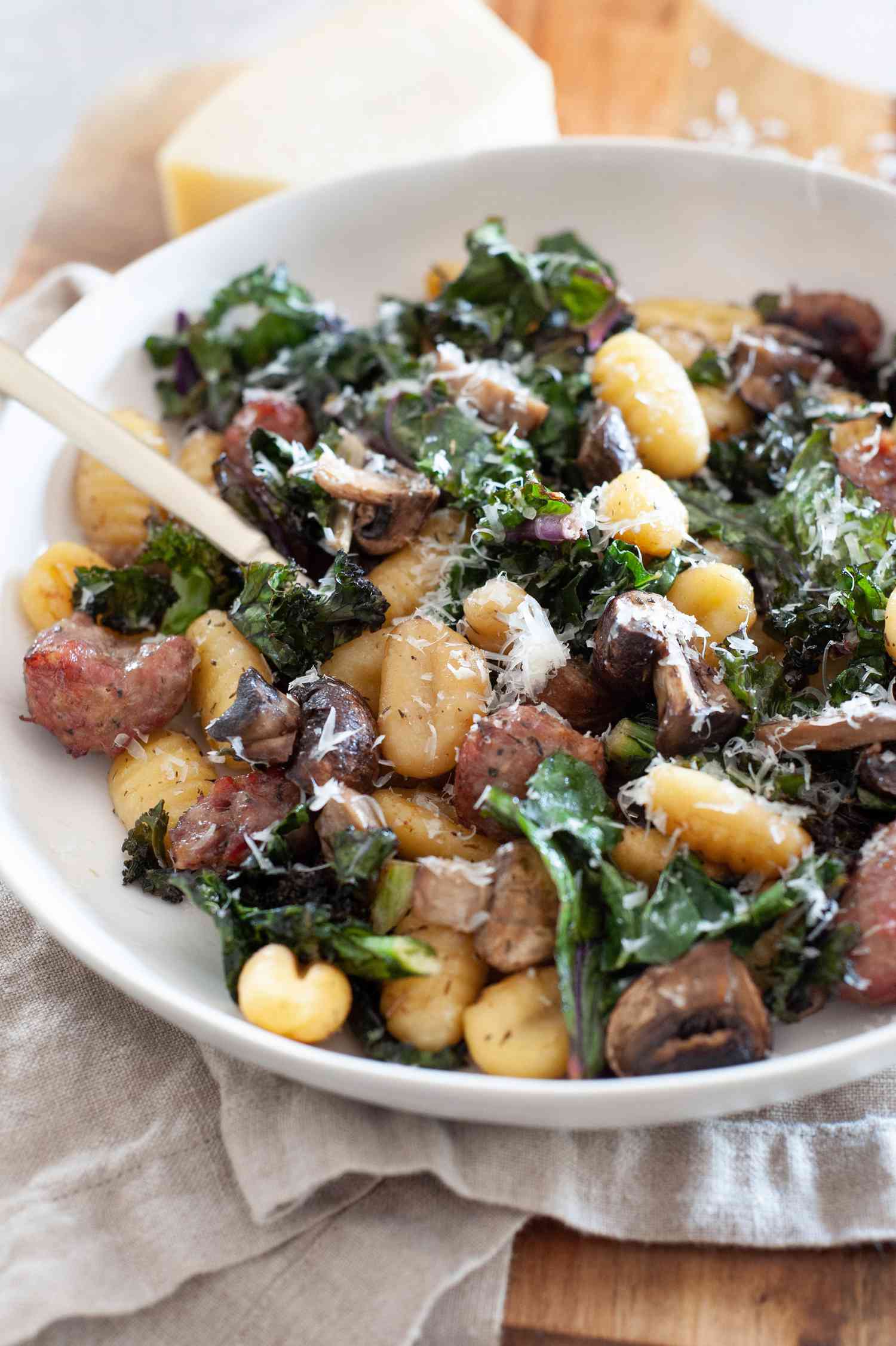 Sheet Pan Gnocchi With Mushrooms, Sausage, and Kale in a Bowl
