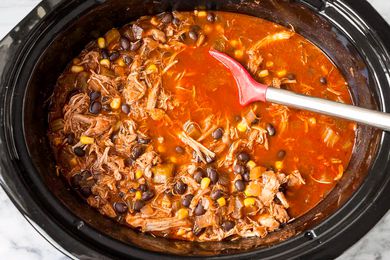 Overhead view of a slow cooker with chicken chili