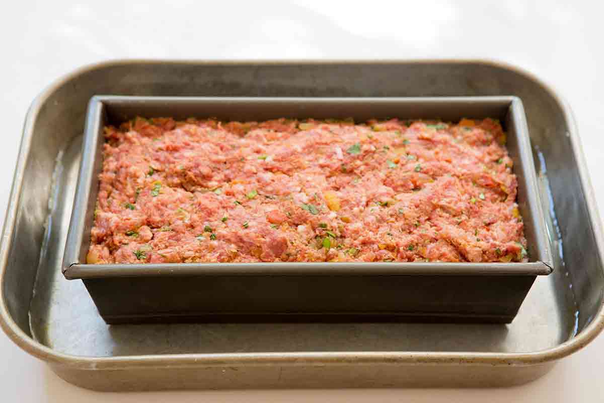 place loaf pan with meatloaf mixture into a large pan with an inch or so of water