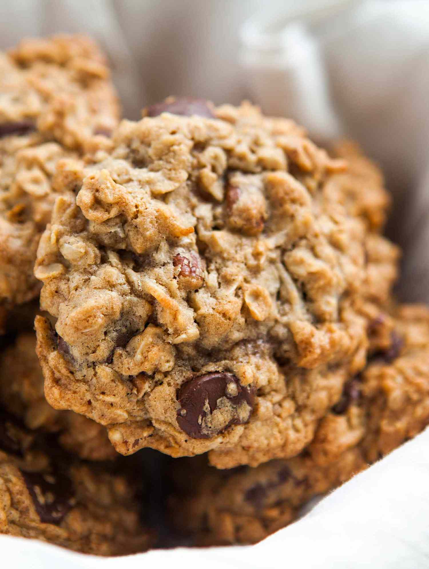 Oatmeal Chocolate Chip Cookies in a basket lined with a linen cloth