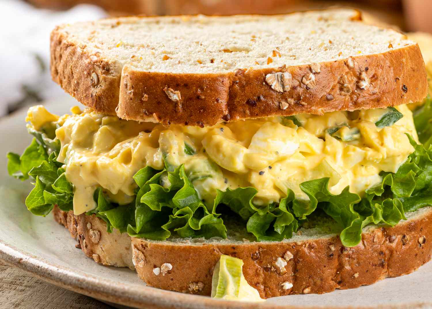 Closeup of egg salad and lettuce sandwich