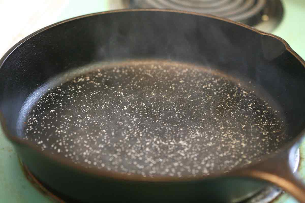 add salt to hot cast iron pan to make sauce for penne pasta