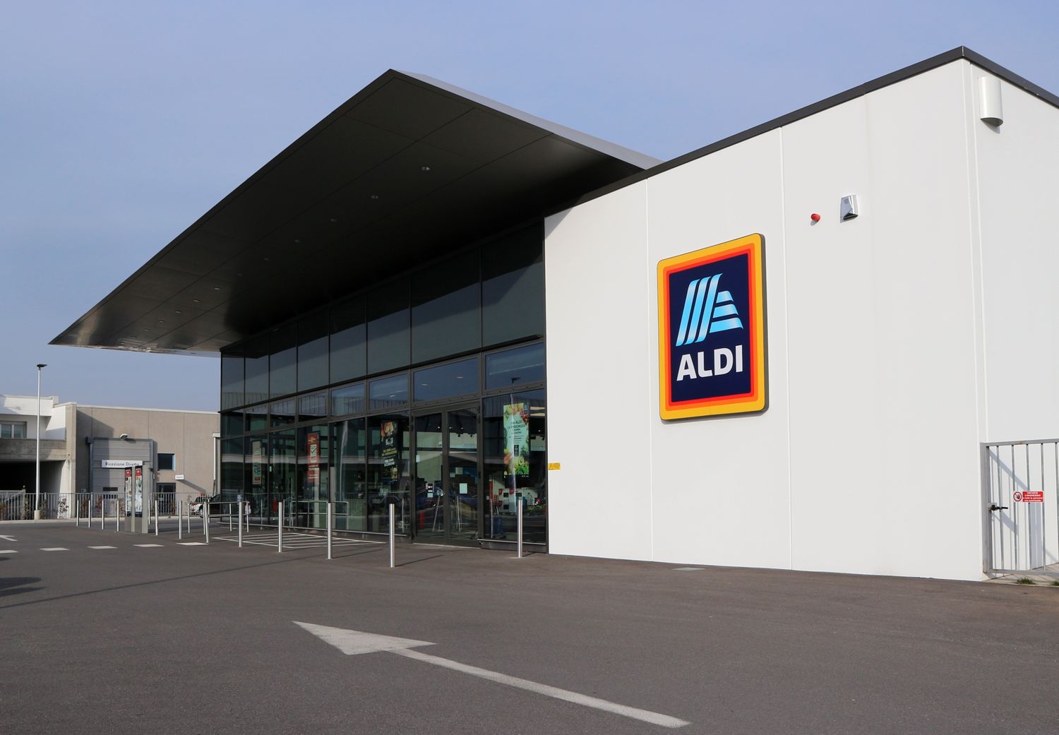 ALDI retail store exterior with a glass storefront and logo sign