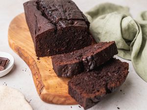 Chocolate pound cake on wooden board.