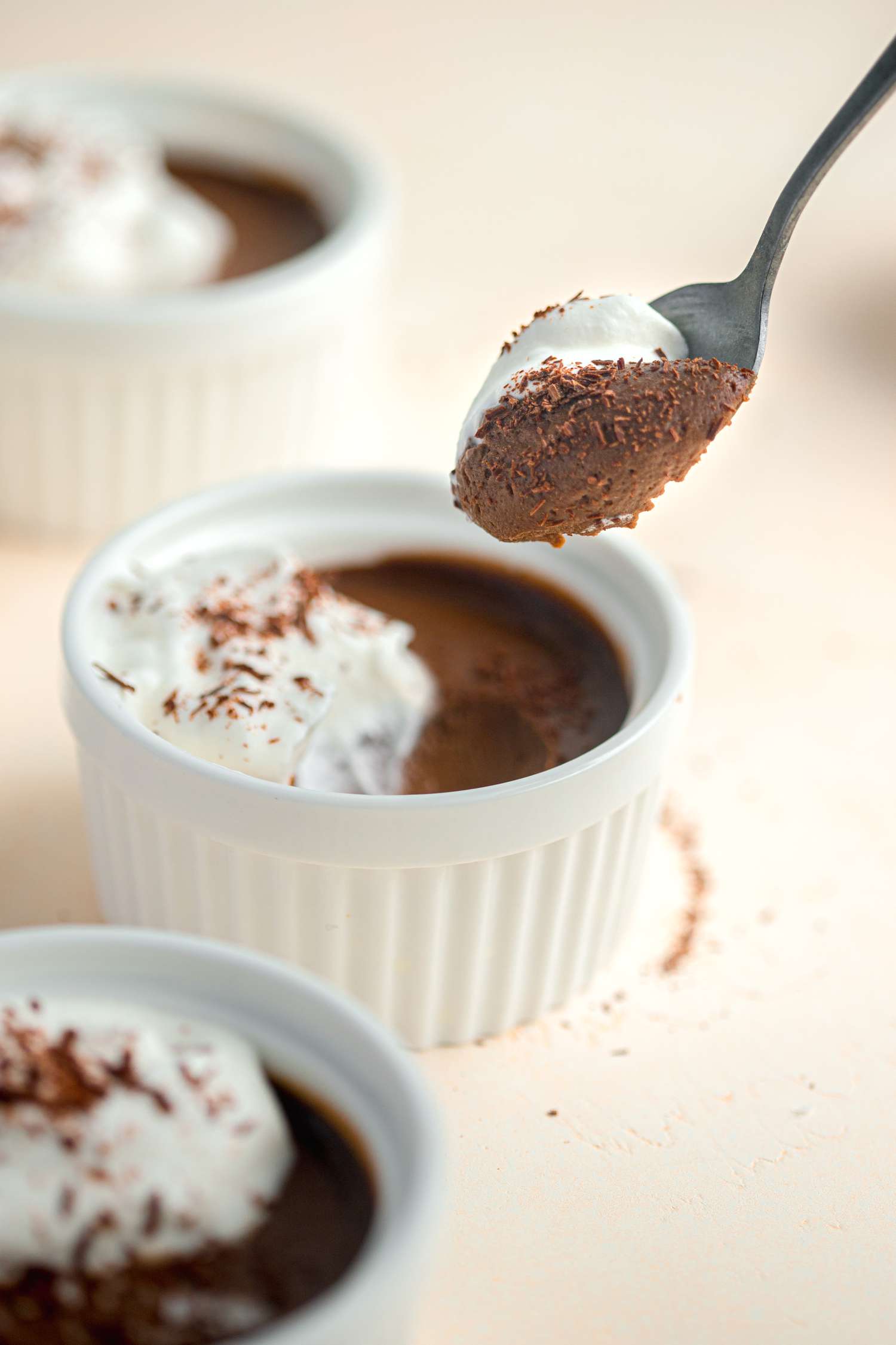 Chocolate Pots de Crème on a Spoon with More in Ramekins