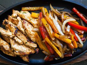 Chicken Fajitas resting in a cast iron platter