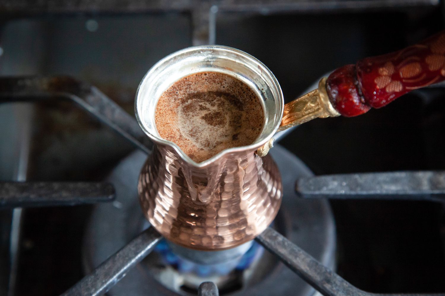 Cezve Heated on a Gas Stove for Authentic Turkish Coffee Recipe