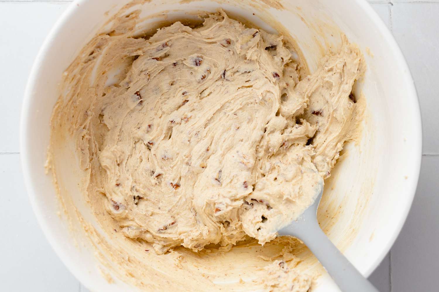 Dry Ingredients Folded into Bowl of Wet Ingredients to Make Turtle Cookie Cup Dough