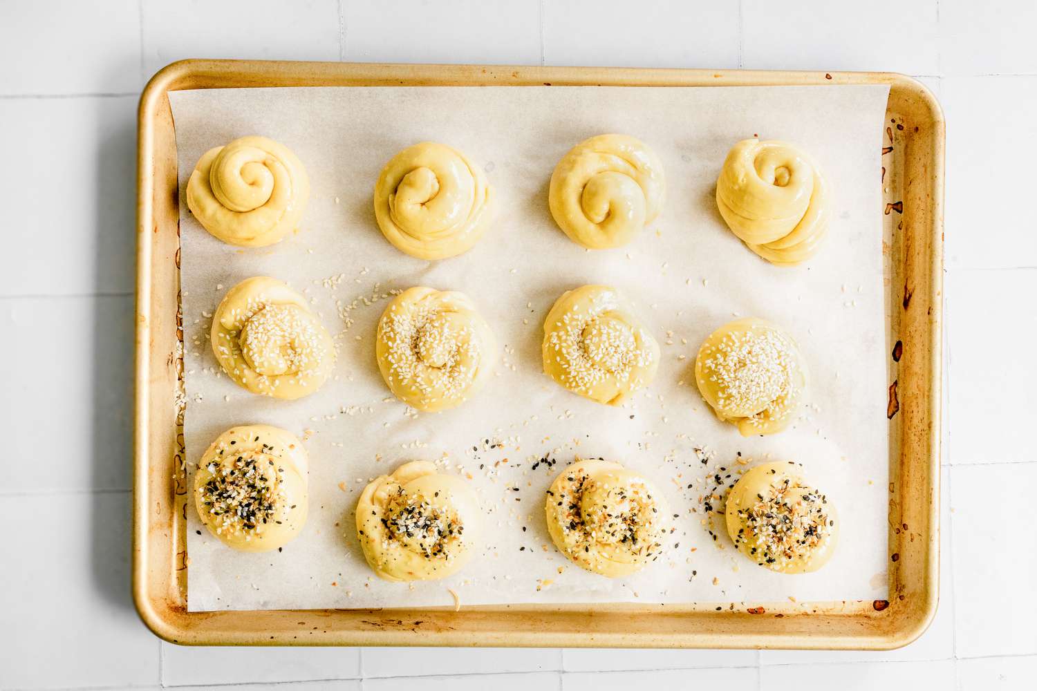 Challah Rolls on Baking Sheet with Egg Wash and Toppings