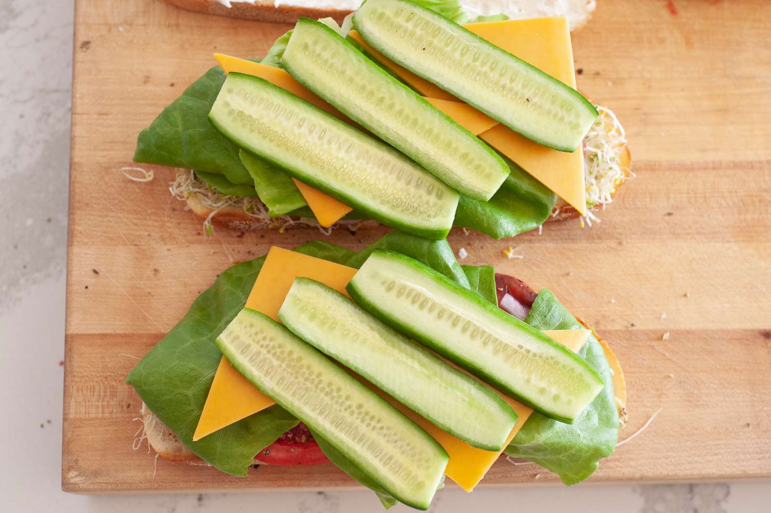 Lettuce, Cheese, and Cucumbers Added to Veggie Sandwich Recipe