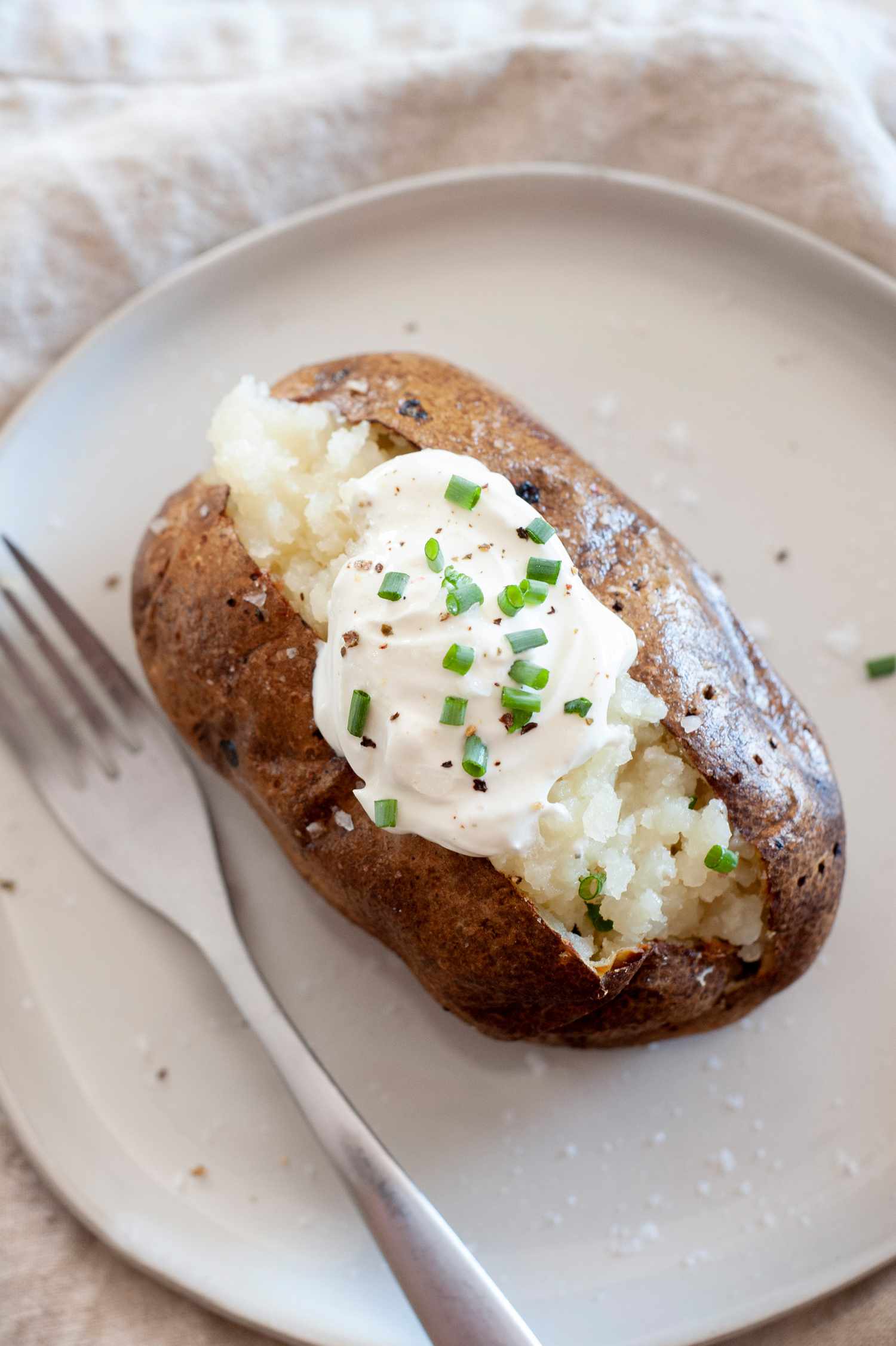 Air Fryer Baked Potatoes Topped with Sour Cream