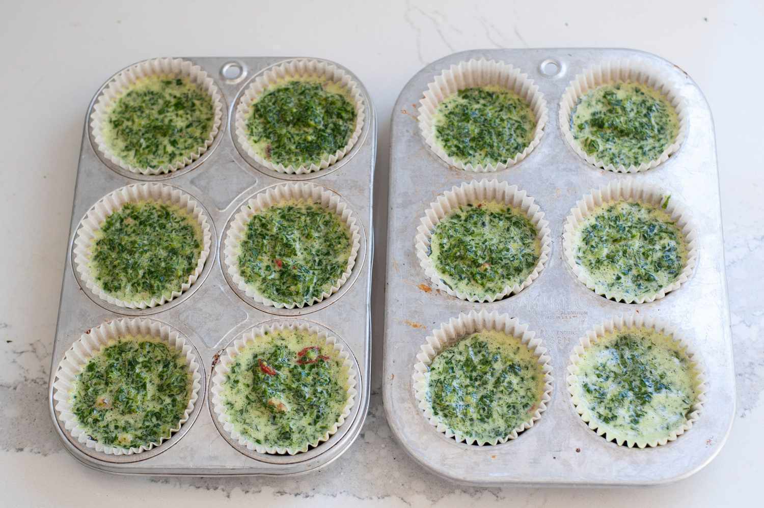 Divide the batter among the 12 muffin cups.