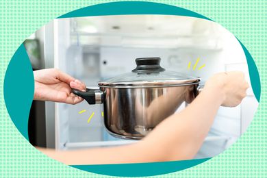 Arms placing pot in the fridge