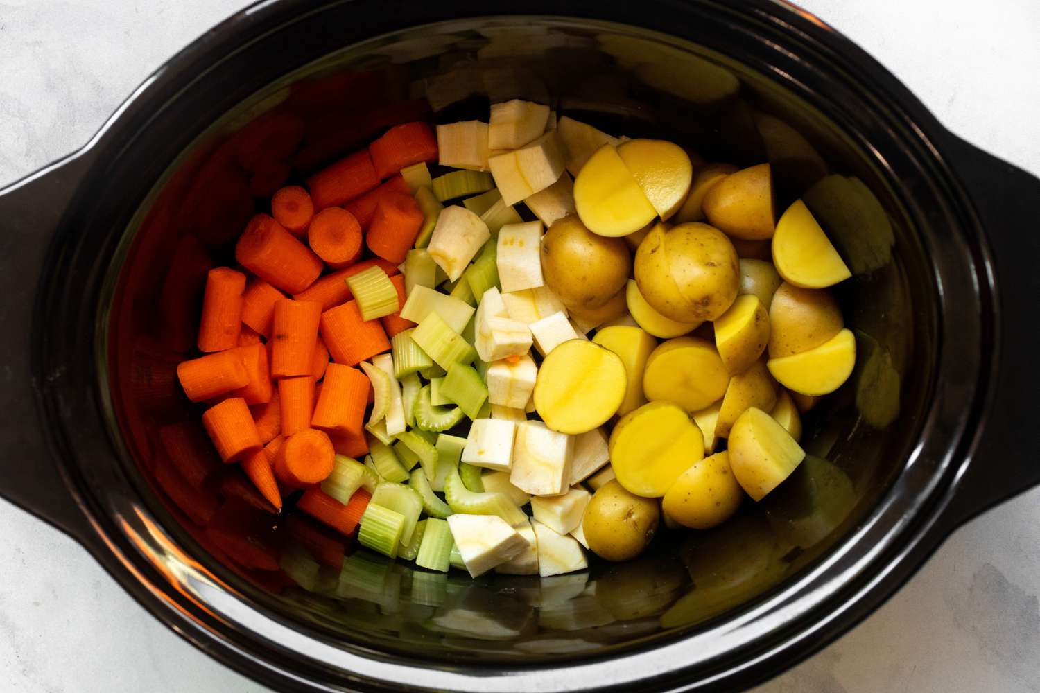 Carrots, Celery, Parsnip, and Potatoes in a Slow Cooker for Beef Stew