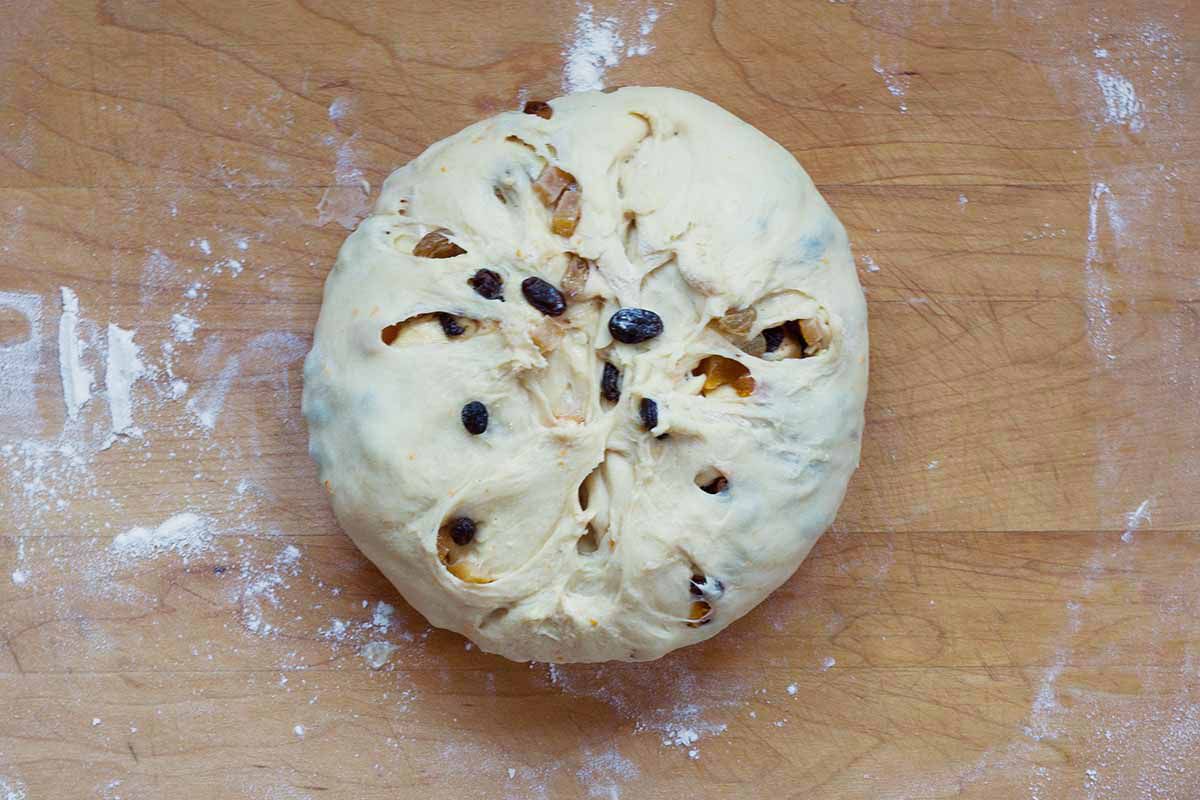 Panettone dough with candied rum soaked fruit shaped into a ball.