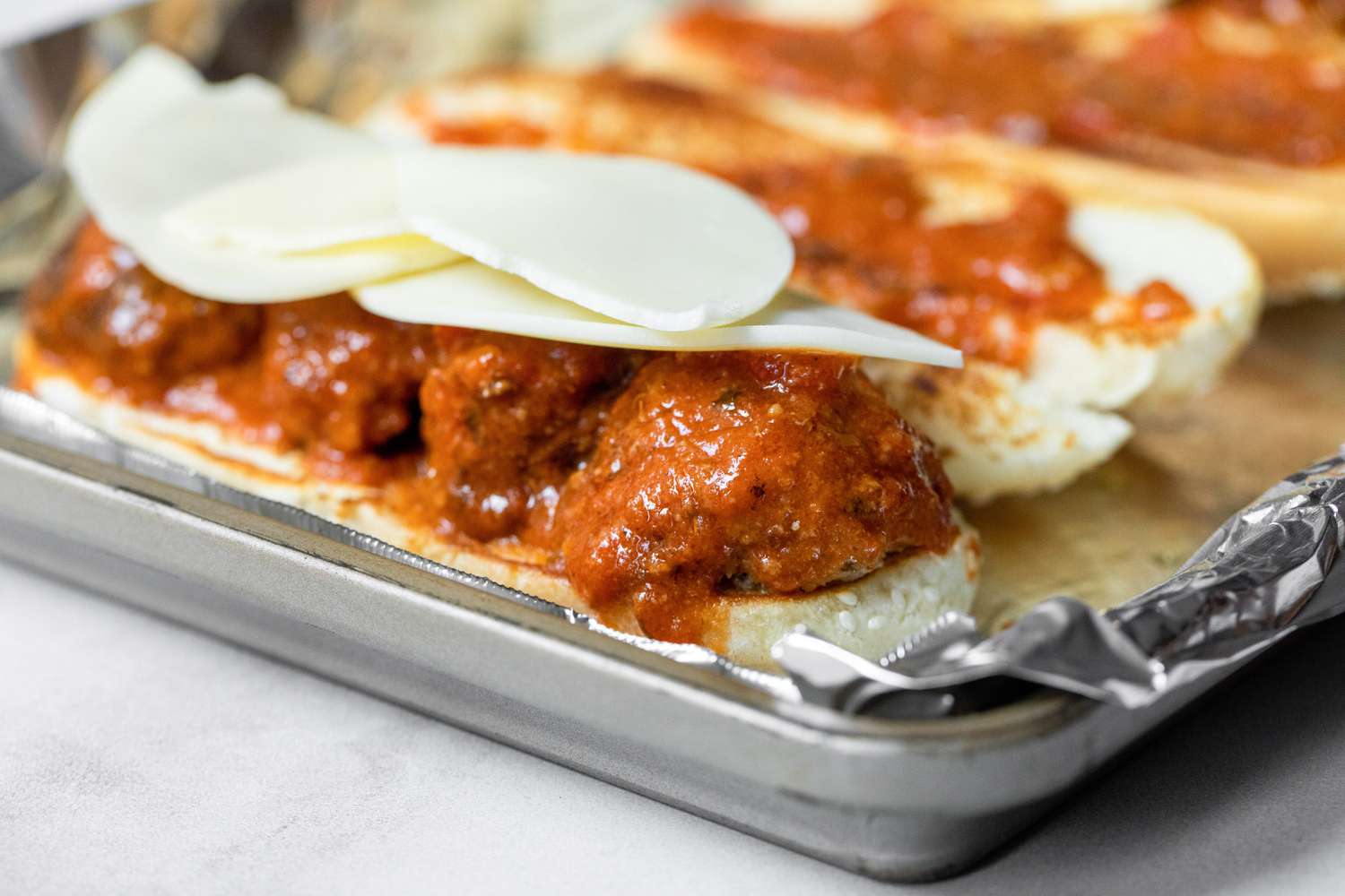 Meatballs, Marinara Sauce, and Provolone Cheese on a Hoagie Bun for Meatball Sub