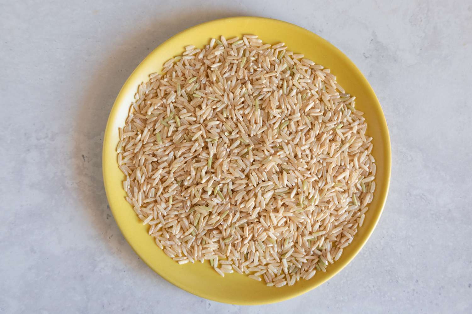 brown rice on a yellow plate