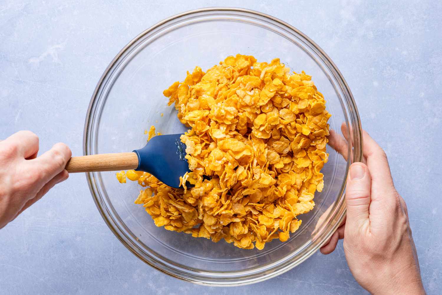 bowl of cornflakes mixed with golden syrup for cornflake tart recipe