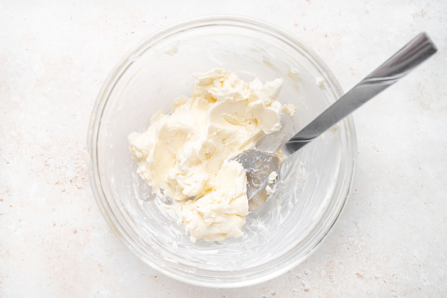 Making buttercream for strawberry macarons.