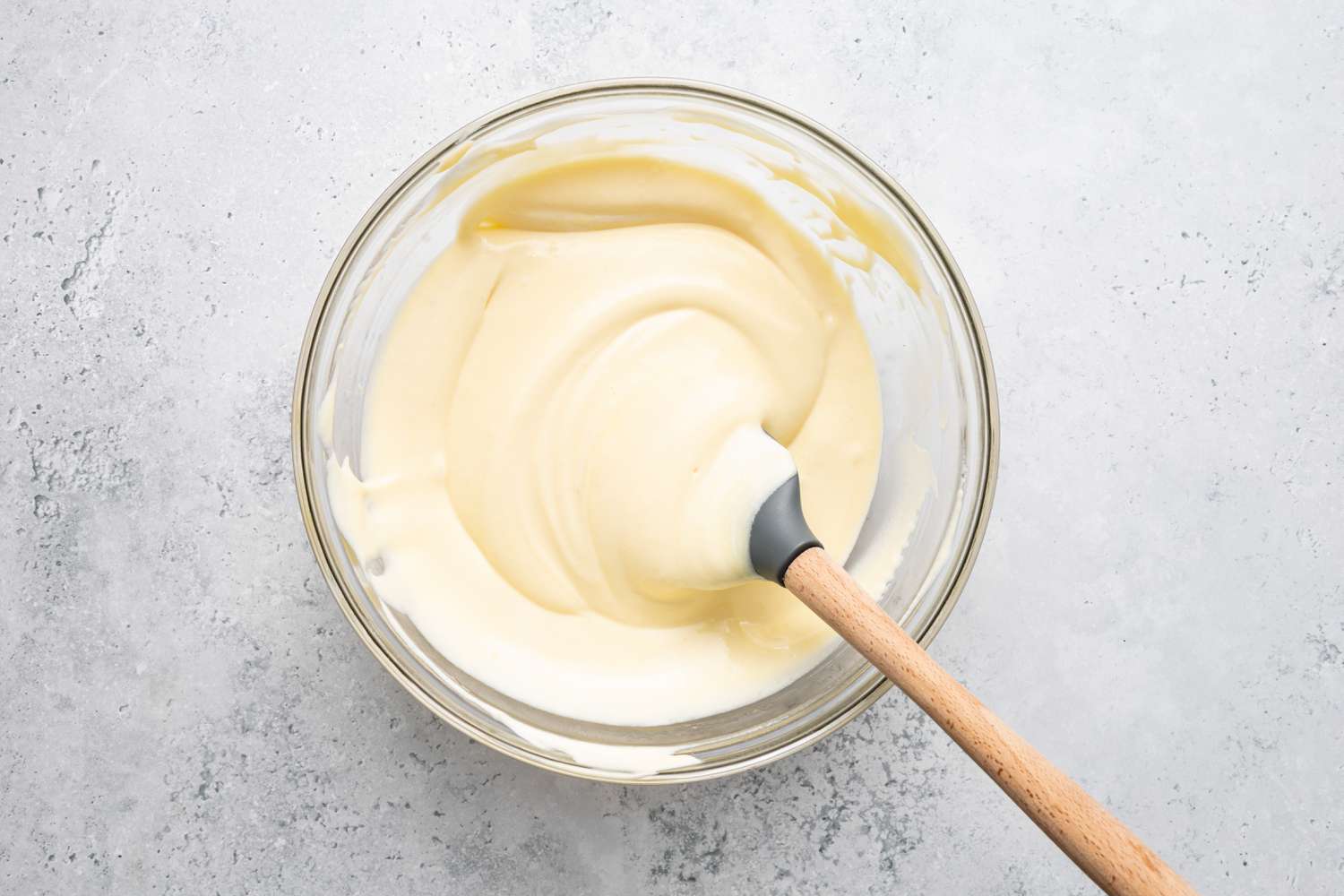 Bee Sting Cake Filling in a Bowl with a Spatula