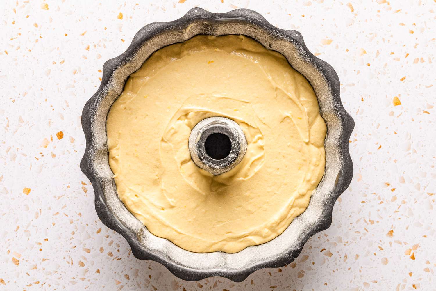 ciambellone batter added to the bundt pan