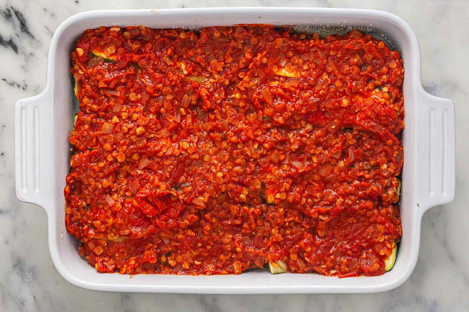 Assemble vegetarian moussaka in casserole