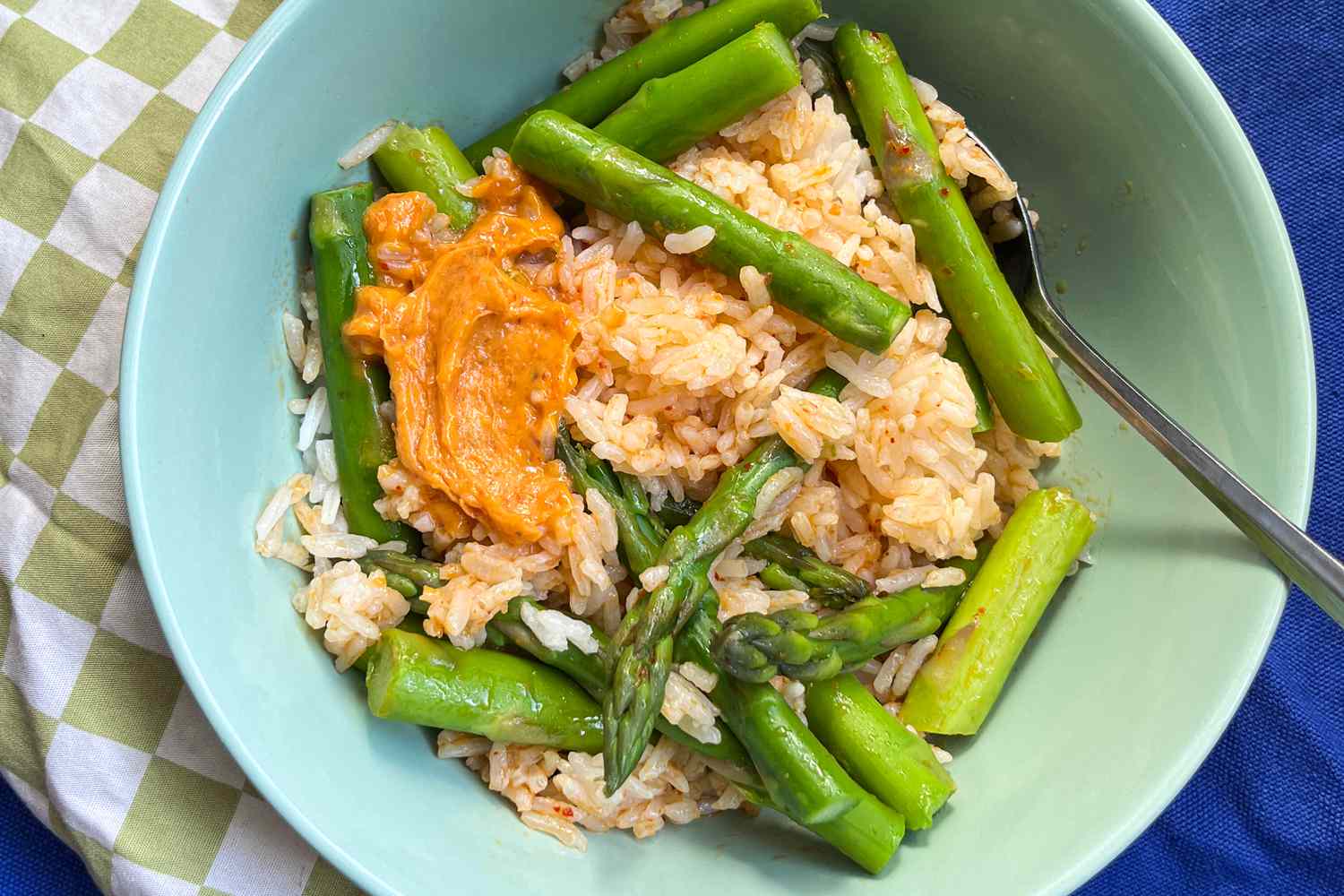 bowl of asparagus and rice with curry butter