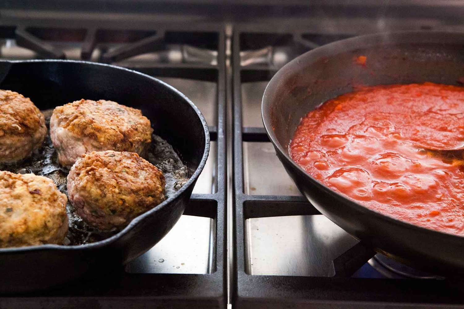 Italian Meatballs cooking in a pan with sauce cooking in another pan