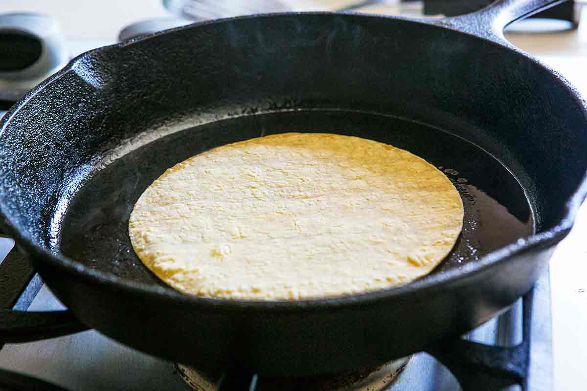 soften corn tortillas before rolling them into enchiladas