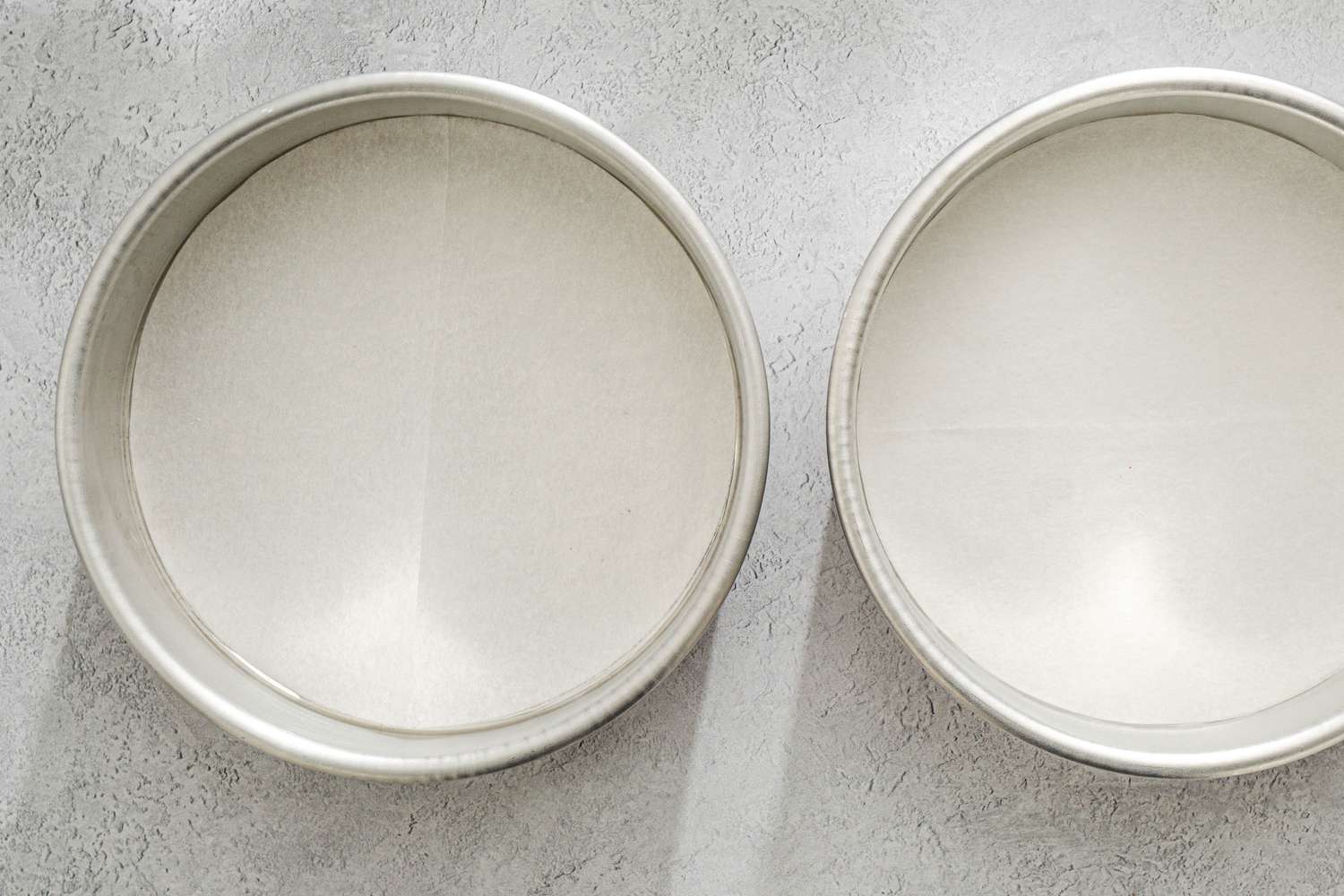 Two 8-inch round cake pans lined with parchment.