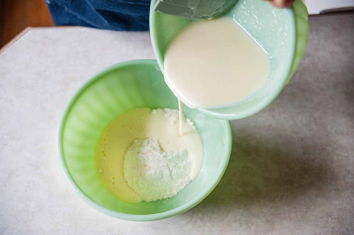 Wet ingredients being added to dry ingredients.