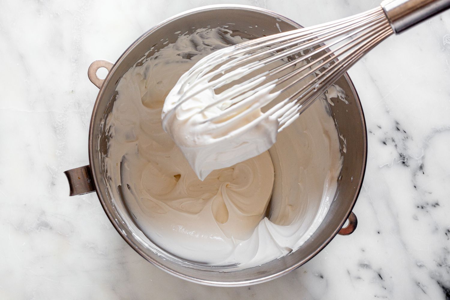 Heavy Cream Whisked to Make Whipping Cream for Victoria Sponge Cake