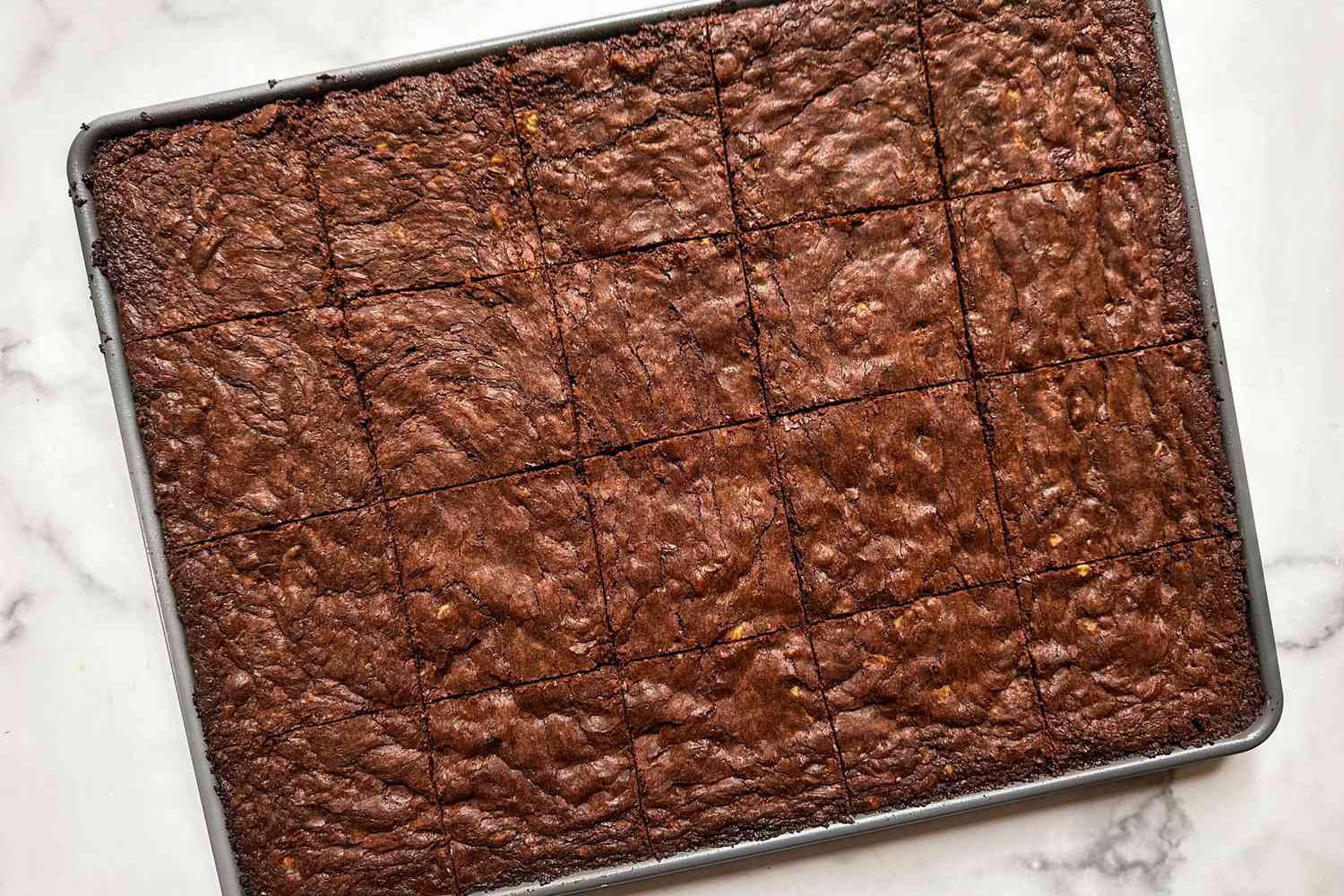 Overhead view of a baking tray with brownies