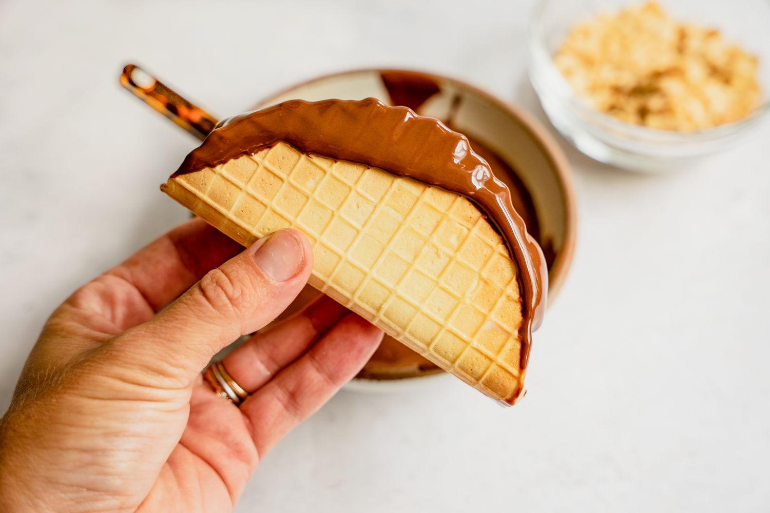 Dip edges of shell with melted chocolate.