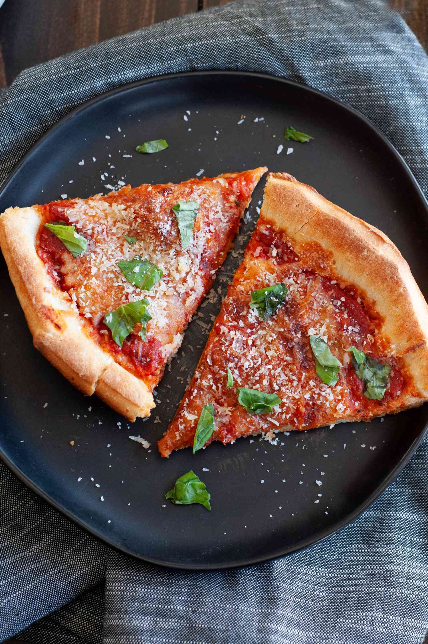 Two slices of cast iron skillet pizza.