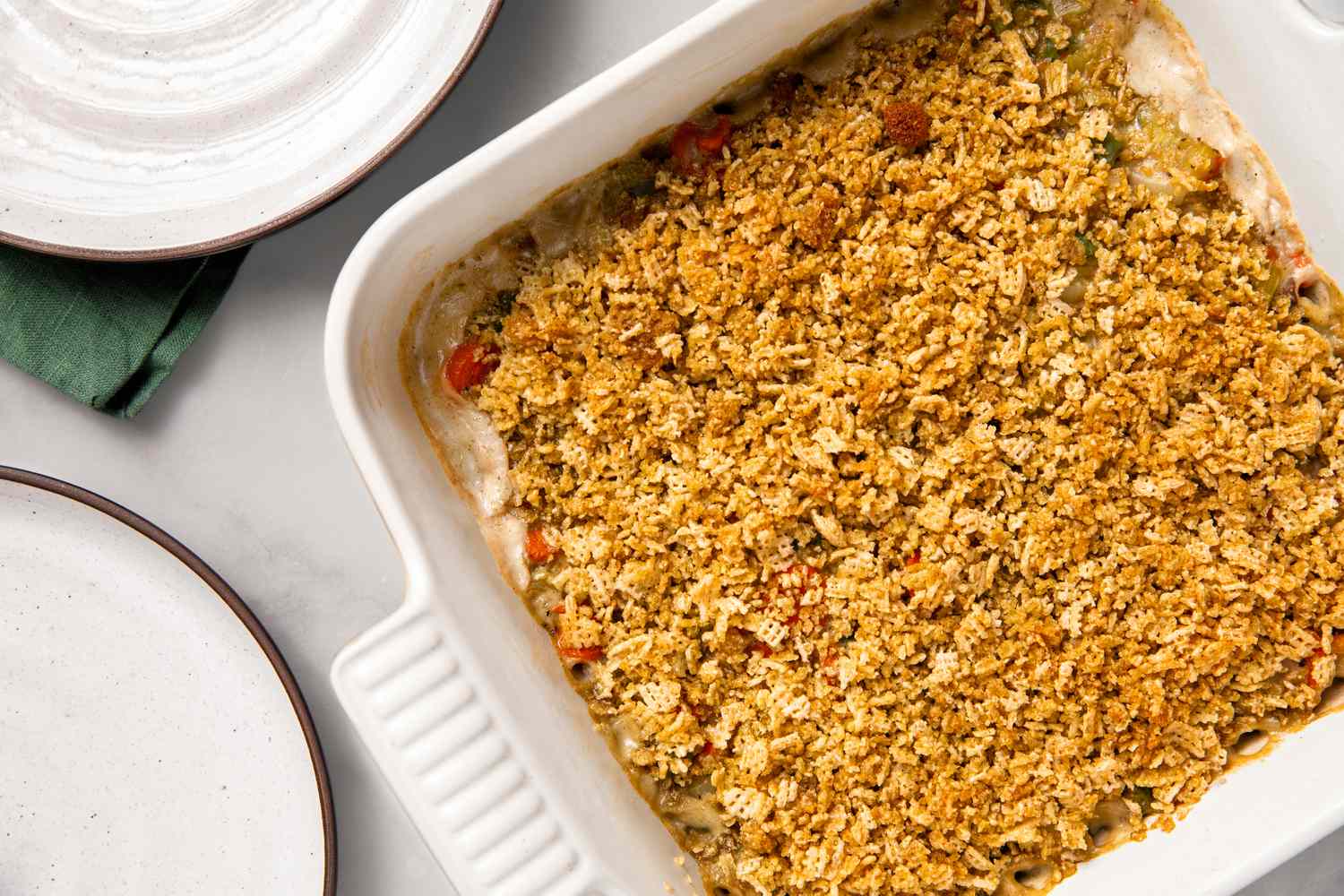 overhead view of Grandma's Creamy Vegetable Casserole with Crunchy Chex Topping in a baking dish