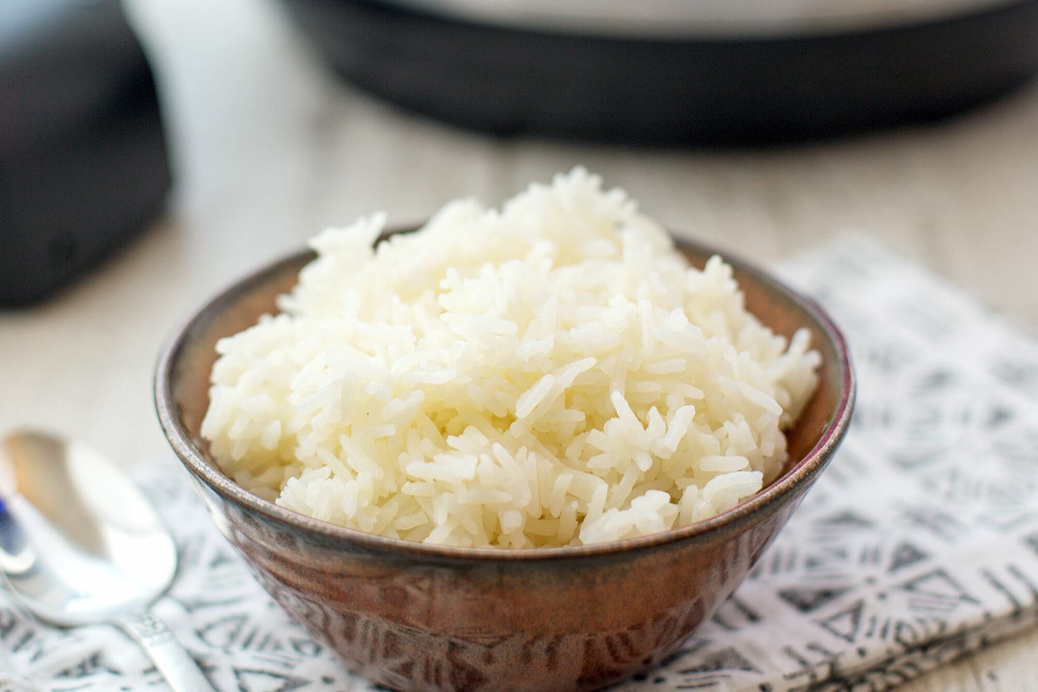 Instant pot rice in a bowl on top of a cloth napkin 