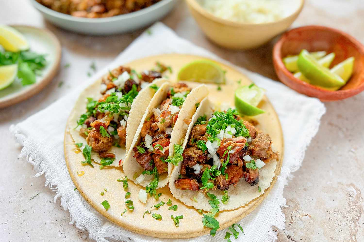 Carnitas Tacos with Chopped Cilantro and Lime Wedges