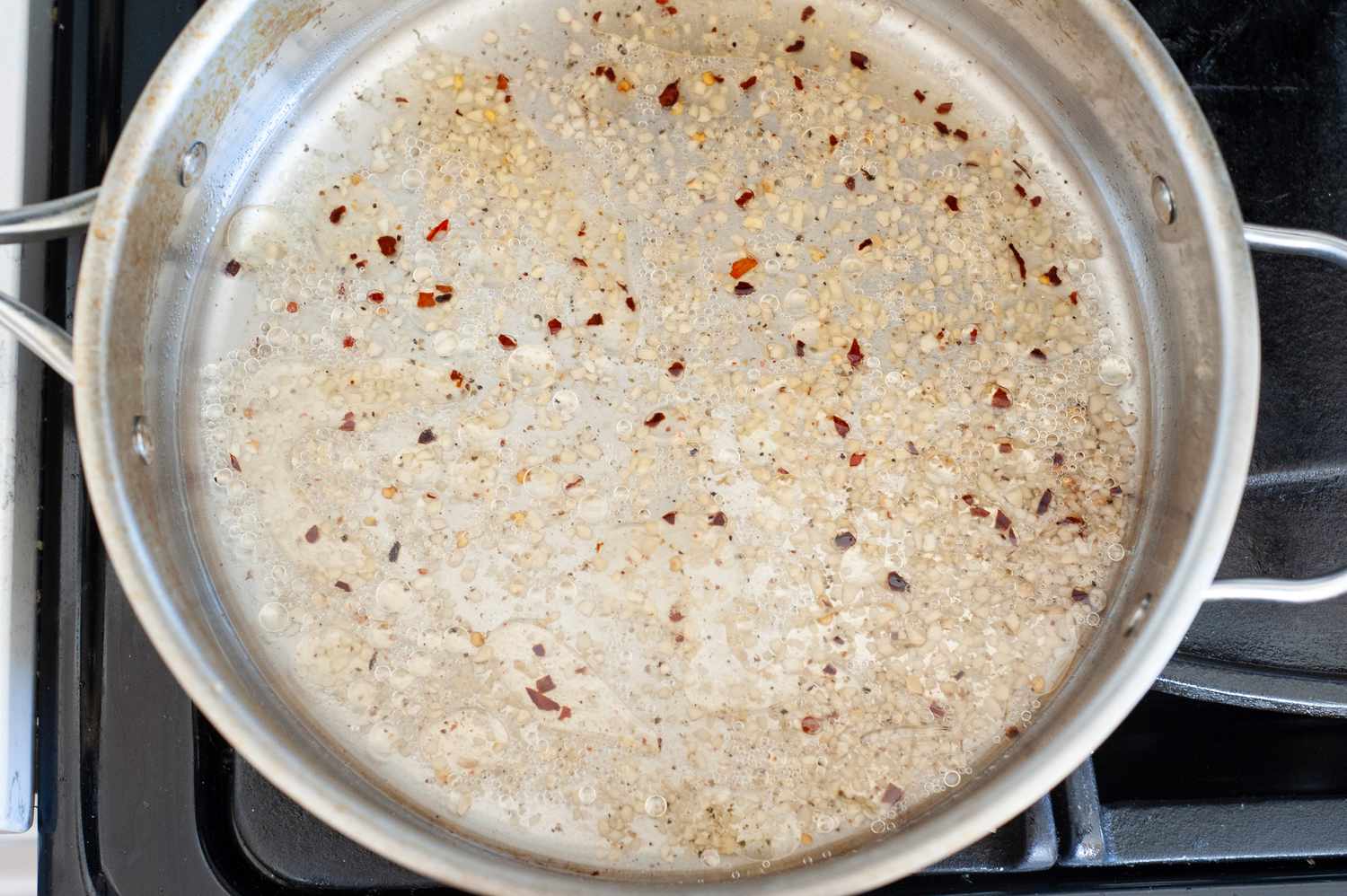 Vodka in Skillet with Garlic and Chili Peppers for Penne alla Vodka