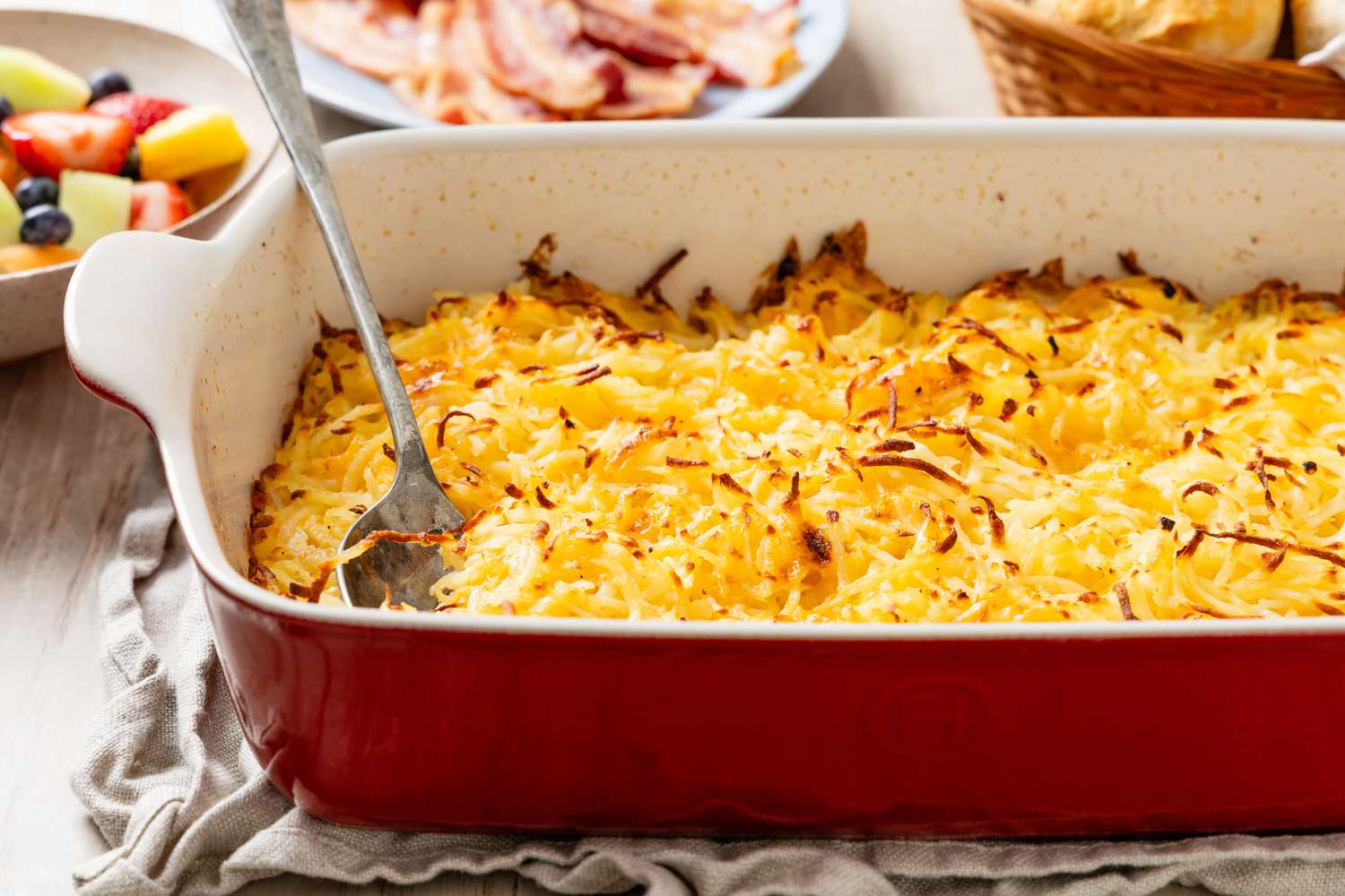 Potato casserole in a red baking dish