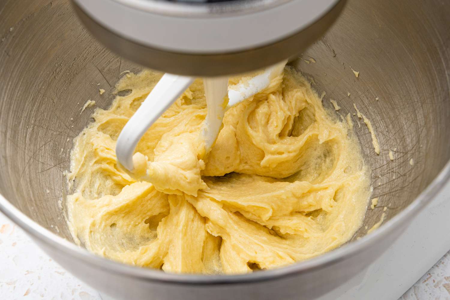 Oil Whisked into Creamed Sugar and Butter Mixture in a Stand Mixer for Blueberry Muffin Tops Recipe