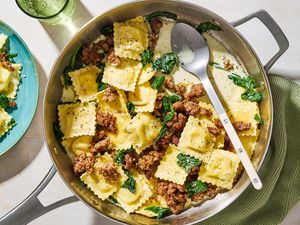 One-Pan Ravioli in a pan with a large spoon