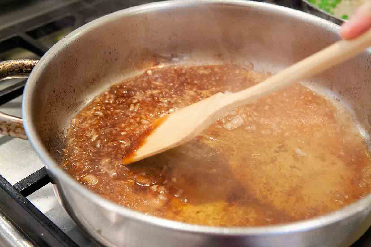 deglazing the pan for peppercorn sauce