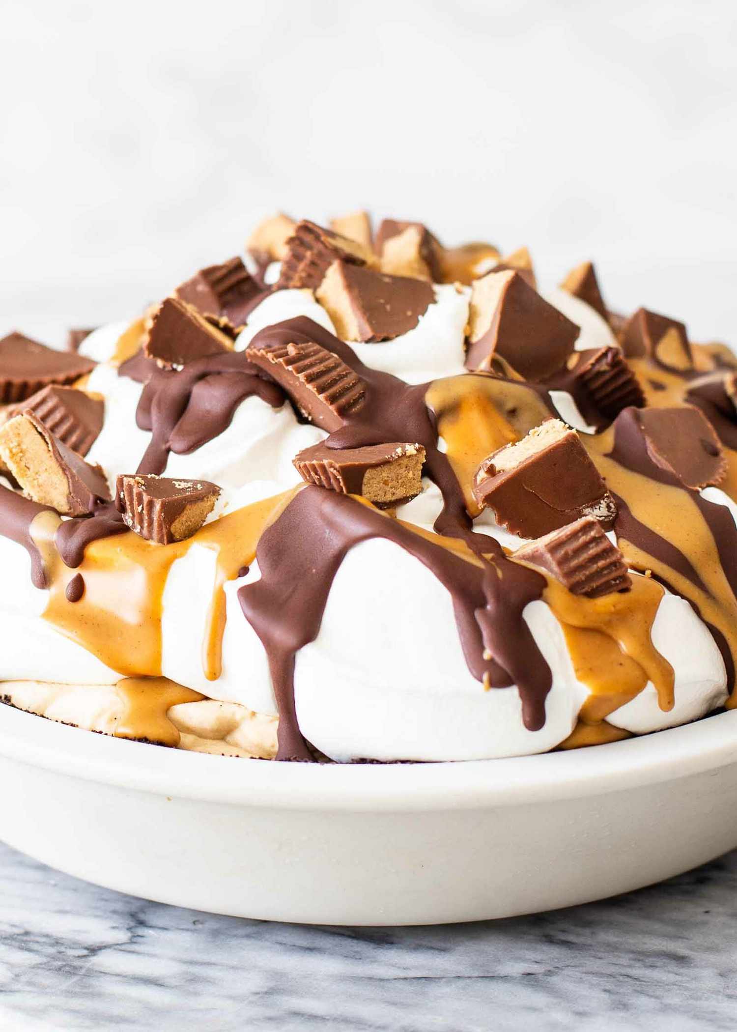 A whole Easy peanut butter pie in a ceramic pie dish.