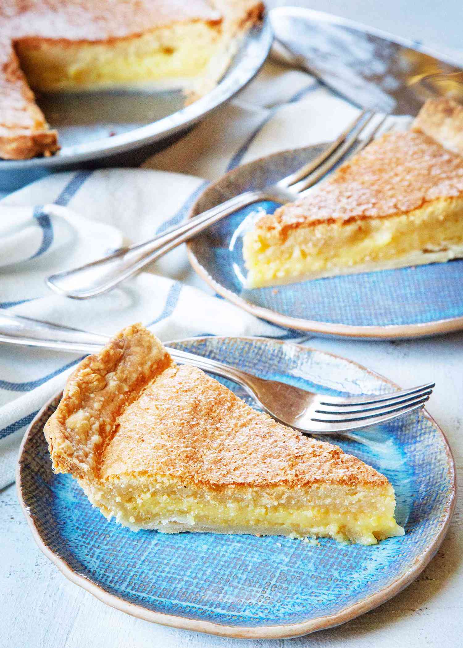 Two plates of the best chess pie with forks.