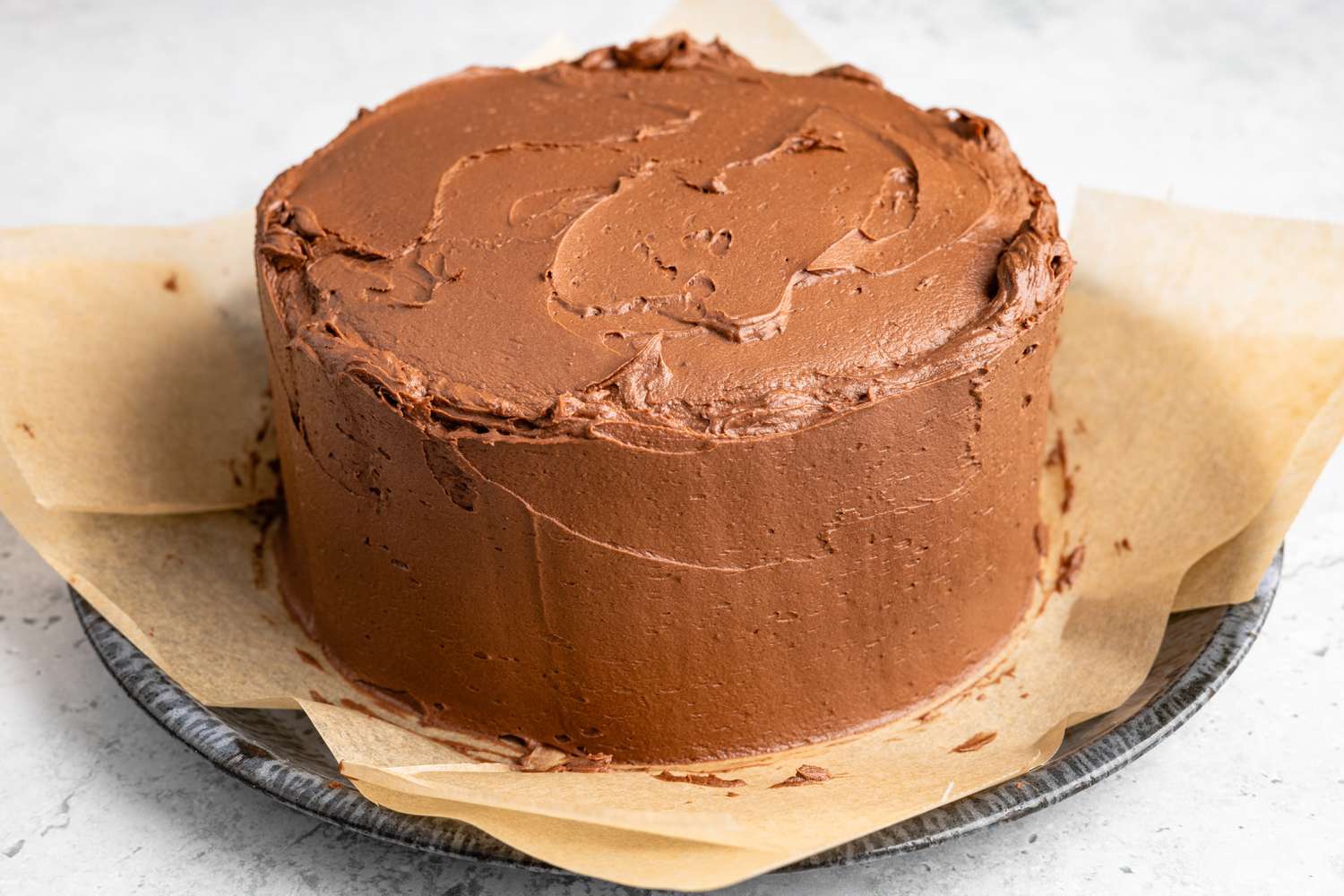 Sides of One-Bowl Double-Layer Chocolate Cake Covered in Frosting 