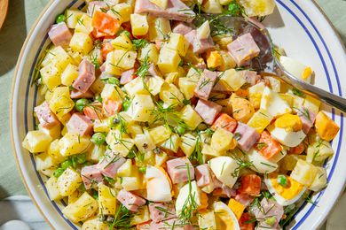 bowl of olivier potato salad on a table