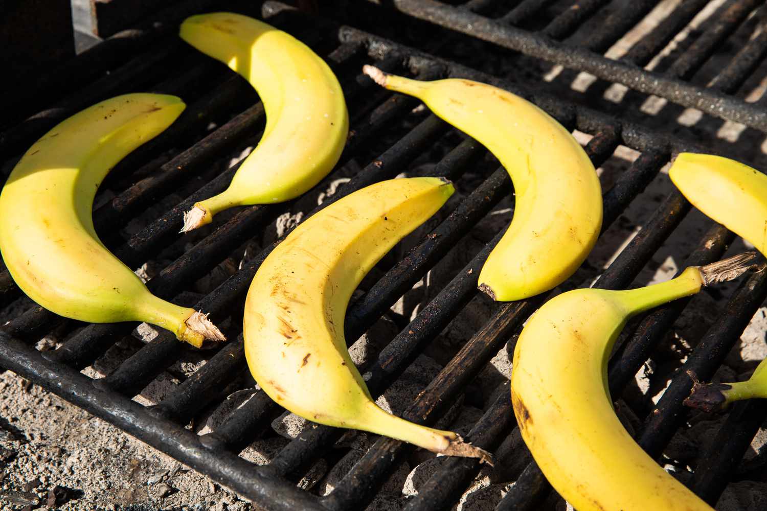 Sliced, Peel on Bananas Roasting on the Grill for Grilled Banana Split Recipe